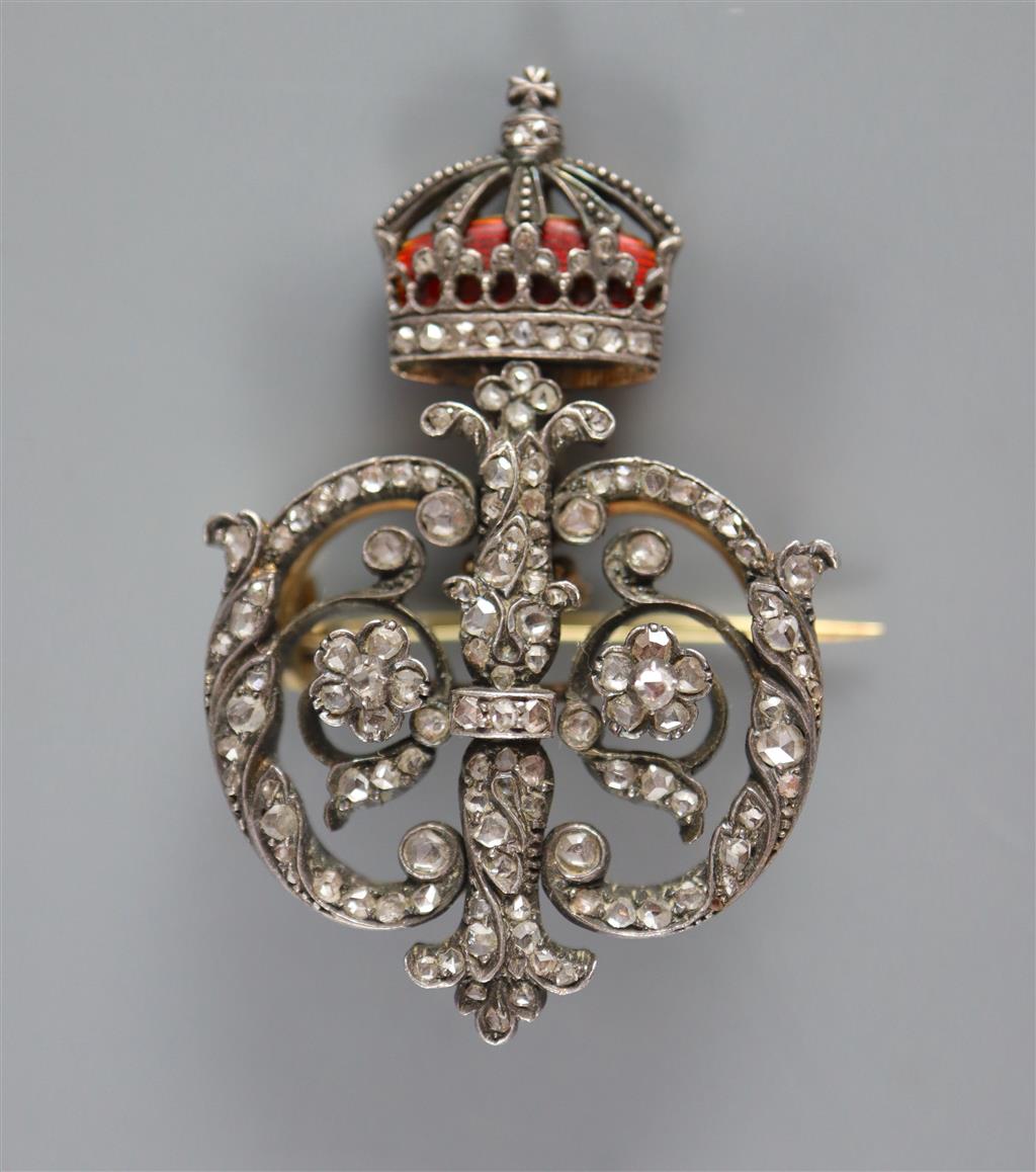 A late 19th/early 20th century Austro-Hungarian 580 standard gold and silver, rose cut diamond and enamel scroll brooch,